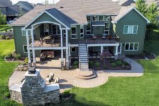 Urbandale, Iowa home with new deck, patio and outdoor fireplace by Silent Rivers