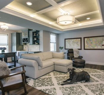 Elegant Clive basement remodel flexes with entertaining, playroom and office space