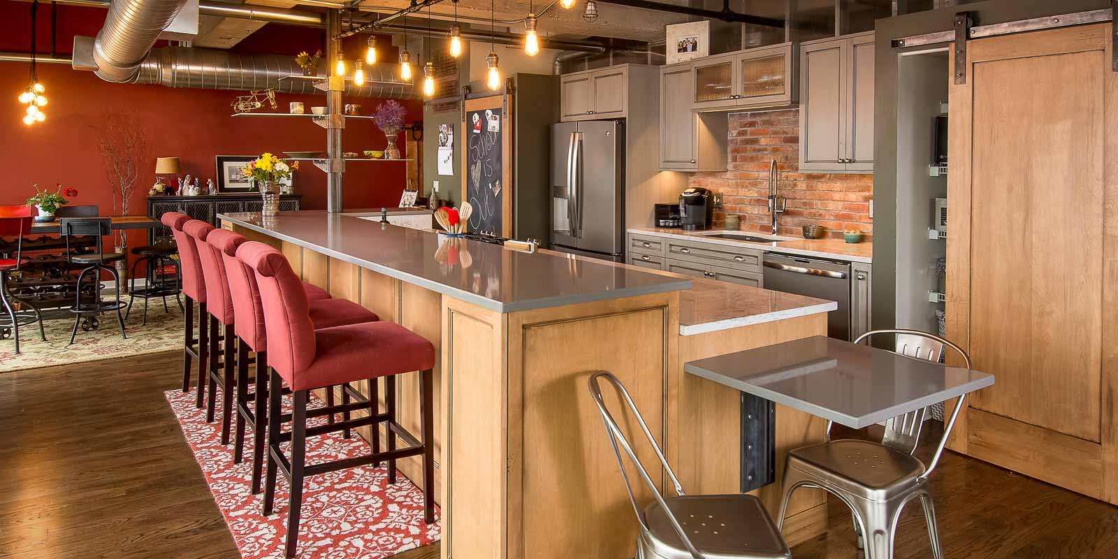 Downtown Des Moines warehouse loft remodel by Silent Rivers urban and traditional style kitchen custom cabinets and light fixtures