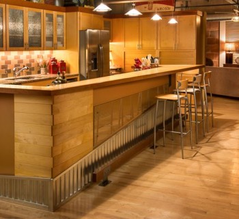 Kitchen Island of a Downtown Loft Redesigned as an Intriguing Bar