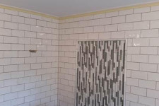 Shower tile done well hides cuts in inconspicuous places
