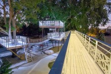 Catwalk bridge to the multi-level treehouse in Johnston, Iowa designed by Silent Rivers