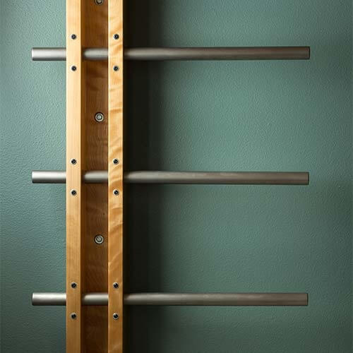 Johnston Iowa contemporary midcentury kitchen remodel by Silent Rivers features custom wall-mounted ladder to lofted playroom