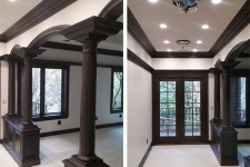 Master suite renovation in Urbandale during construction by Silent Rivers, arched colonnade and patio entrance, custom woodwork and crown molding
