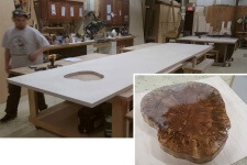 Alex Schlepphorst of Silent Rivers has made the precise cutout for the silver maple tree stump that will support the 16 foot island in a downtown Des Moines loft kitchen remodeled by Silent Rivers