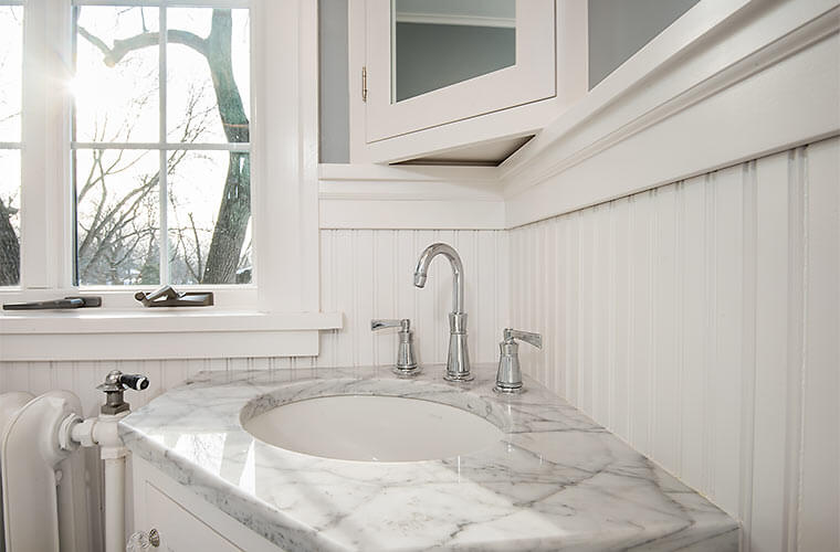 Des Moines, Iowa craftsman bathroom remodel with corner vanity, white and gray tile by Silent Rivers