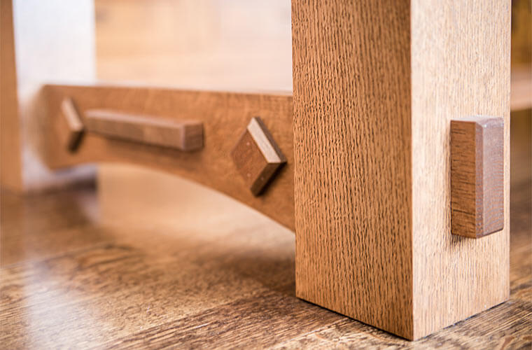 West Des Moines, Iowa craftsman kitchen remodel by Silent Rivers includes custom made dining room table of solid quartersawn white oak with diamond details to match custom kitchen cabinets