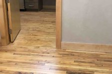 Finished reclaimed wood floor in historic Green & Main building features original maple floor and salvaged flooring from closed Cambria, Iowa school gym