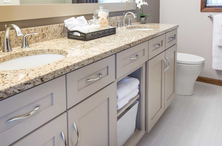 1980s bathroom remodel by Silent Rivers, Des Moines with soft color palette, granite counter, custom cabinet double vanity