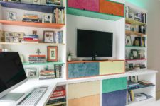 Custom cabinetry in white with custom color drawers and shelves were designed and built into this Des Moines condo by Silent Rivers