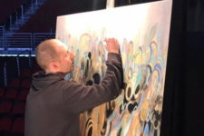 Chris Vance completes a live painting at the Des Moines Arts Festival REVEAL event announcing 2017 exhibiting artists