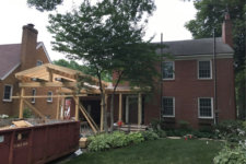 in progress photo showing framed new carport on 1935 Des Moines Federal style home by remodeler Silent Rivers
