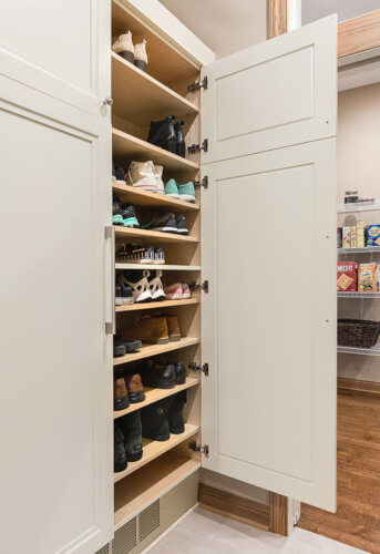 custom shoe storage cabinet in mudroom by remodeler Silent Rivers, Clive, Iowa