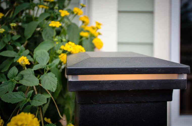 integrated deck railing lights illuminate deck and patio by builder Silent Rivers, Des Moines, Iowa