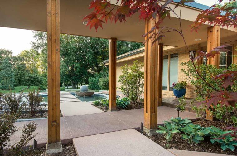 contemporary front entry courtyard with spherical water fountain and Japanese maple in concentric circle design in Johnston, Iowa by Silent Rivers