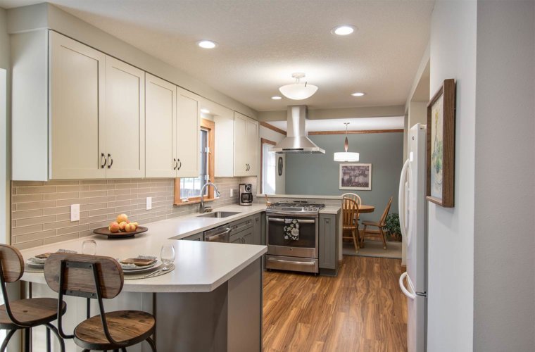 transition white and gray remodel of 1980s galley small kitchen in Des Moines by designer builder Silent Rivers