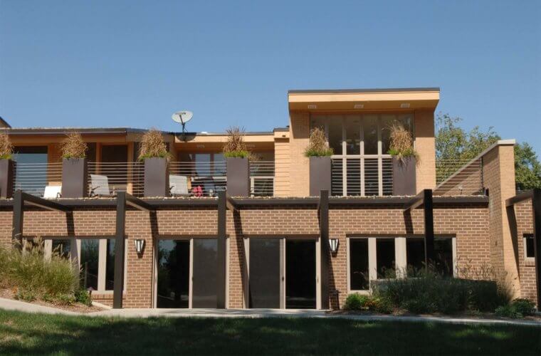 addition to midcentury home in Johnston, Iowa by Silent Rivers includes indoor pool, outdoor hot tub, roof deck and patio