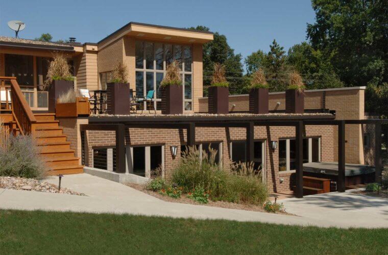 addition to midcentury home in Johnston, Iowa by Silent Rivers includes indoor pool, outdoor hot tub, roof deck and patio