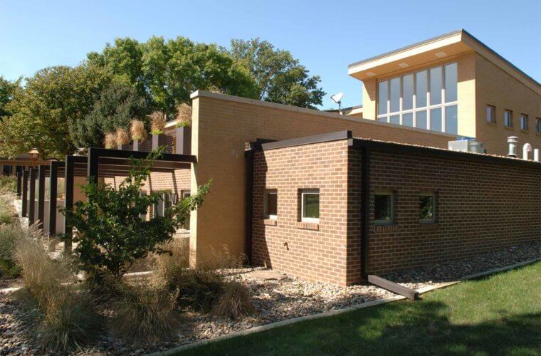 addition to midcentury home in Johnston, Iowa by Silent Rivers includes indoor pool, outdoor hot tub, roof deck and patio
