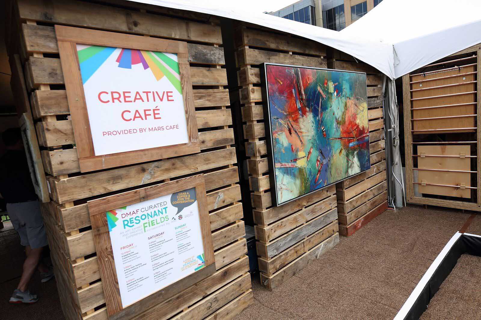 Gaston Carrio artwork, DMAF Curated exhibit and presentations in the Creative Cafe area of the Silent Rivers VIP Club at the 2018 Des Moines Arts Festival