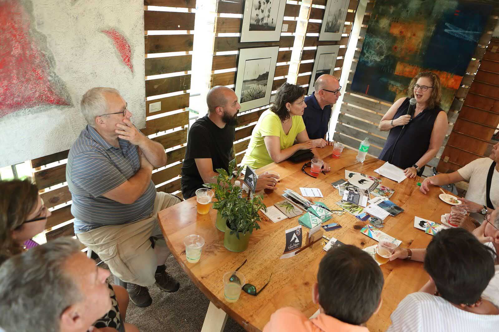 Dr. Lenore Metrick-Chen, art history professor, DMAF Curated exhibit and presentations in the Creative Cafe area of the Silent Rivers VIP Club at the 2018 Des Moines Arts Festival