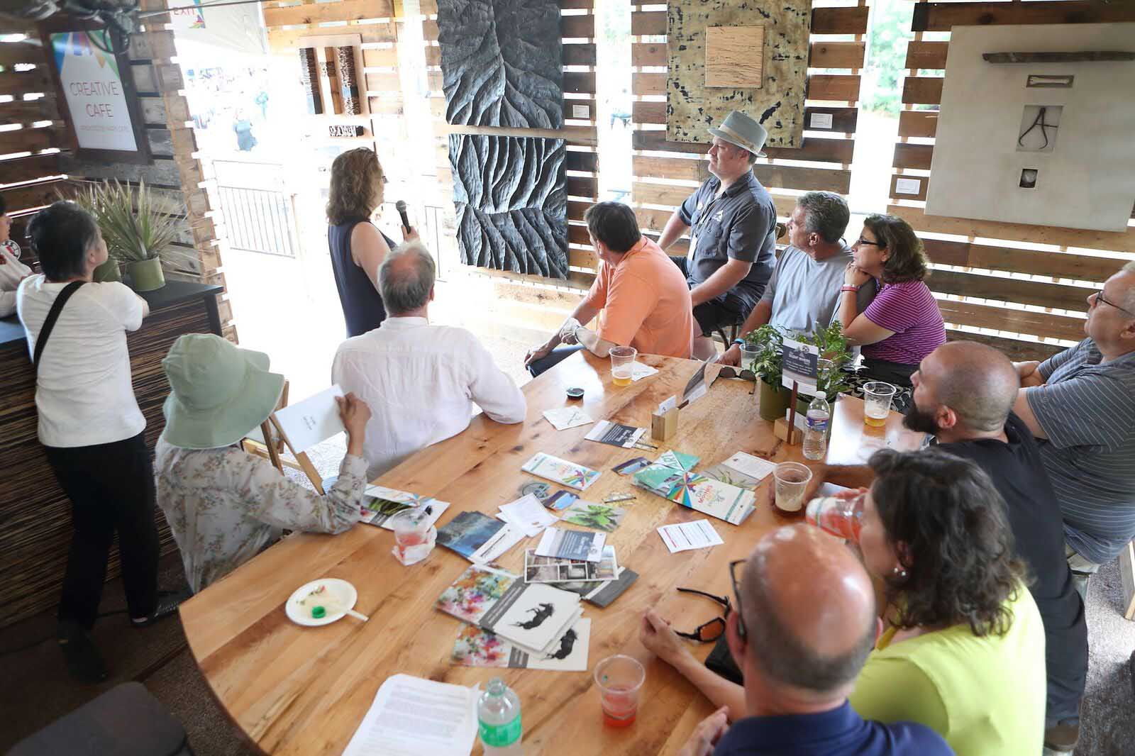 Dr. Lenore Metrick-Chen, art history professor, DMAF Curated exhibit and presentations in the Creative Cafe area of the Silent Rivers VIP Club at the 2018 Des Moines Arts Festival