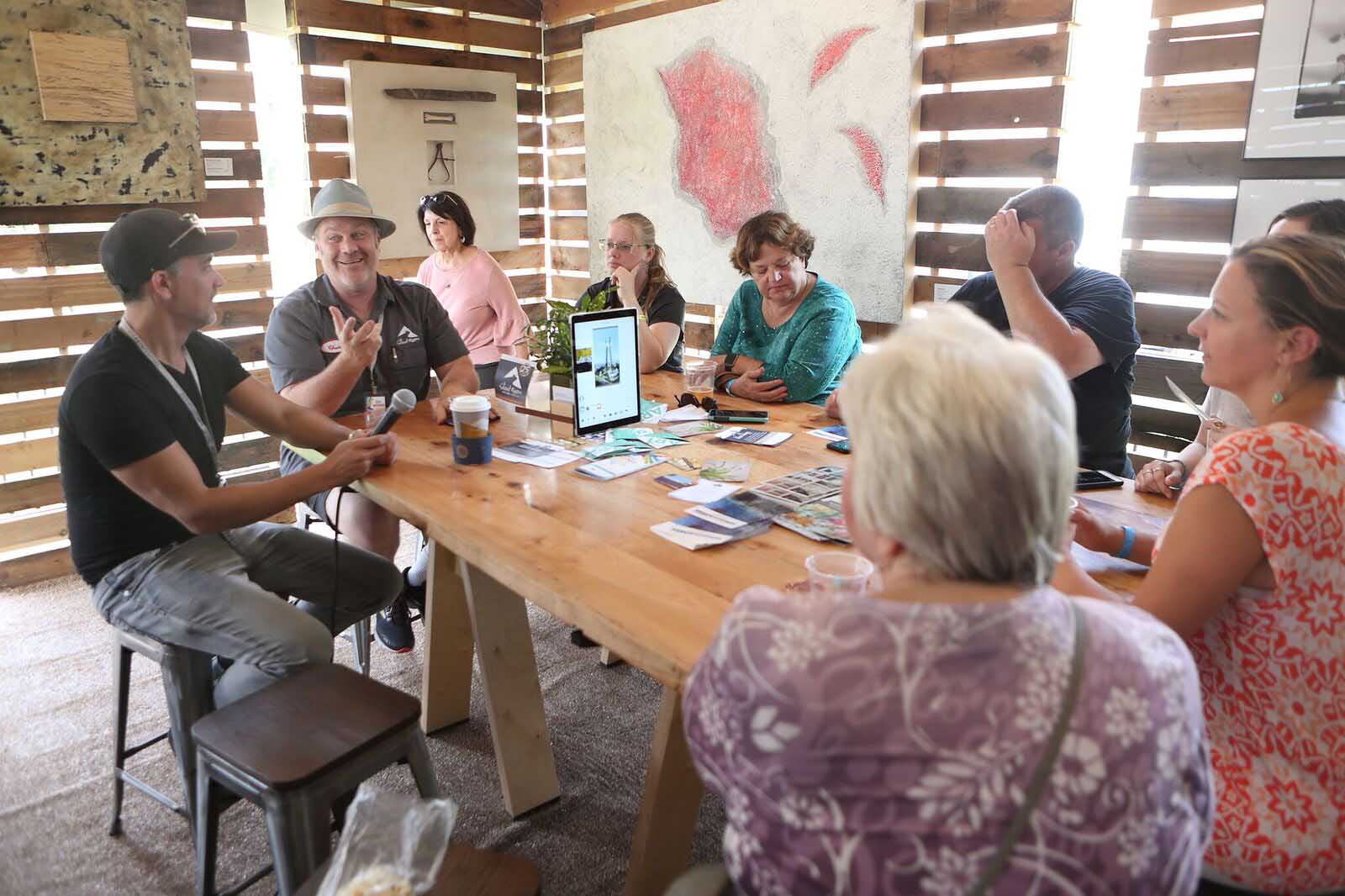 DMAF Curated exhibit and presentations in the Creative Cafe area of the Silent Rivers VIP Club at the 2018 Des Moines Arts Festival