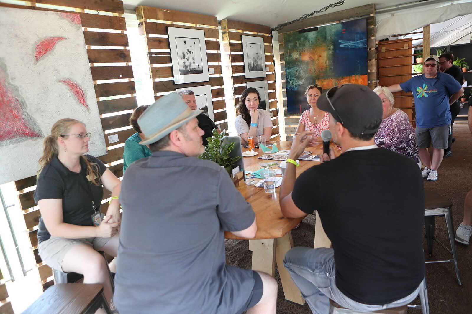 DMAF Curated exhibit and presentations in the Creative Cafe area of the Silent Rivers VIP Club at the 2018 Des Moines Arts Festival