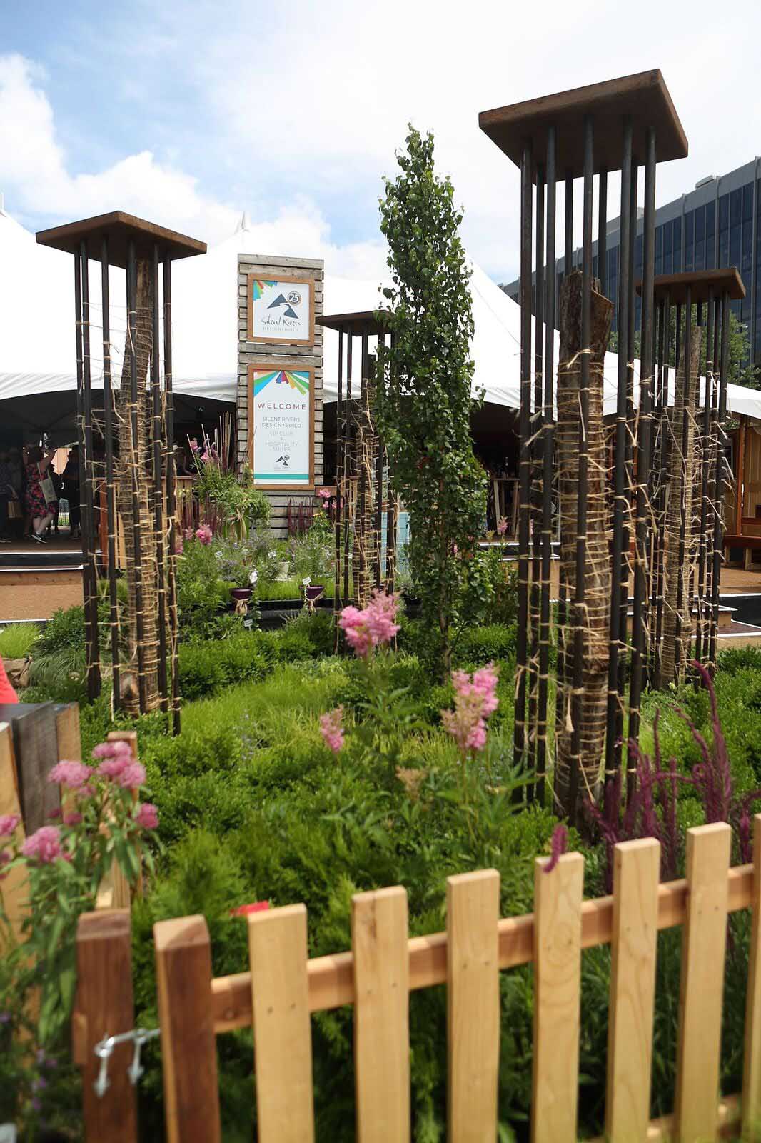 Sculpture by Chaden Halfhill for Silent Rivers VIP Club at 2018 Des Moines Arts Festival with sustainable materials and garden