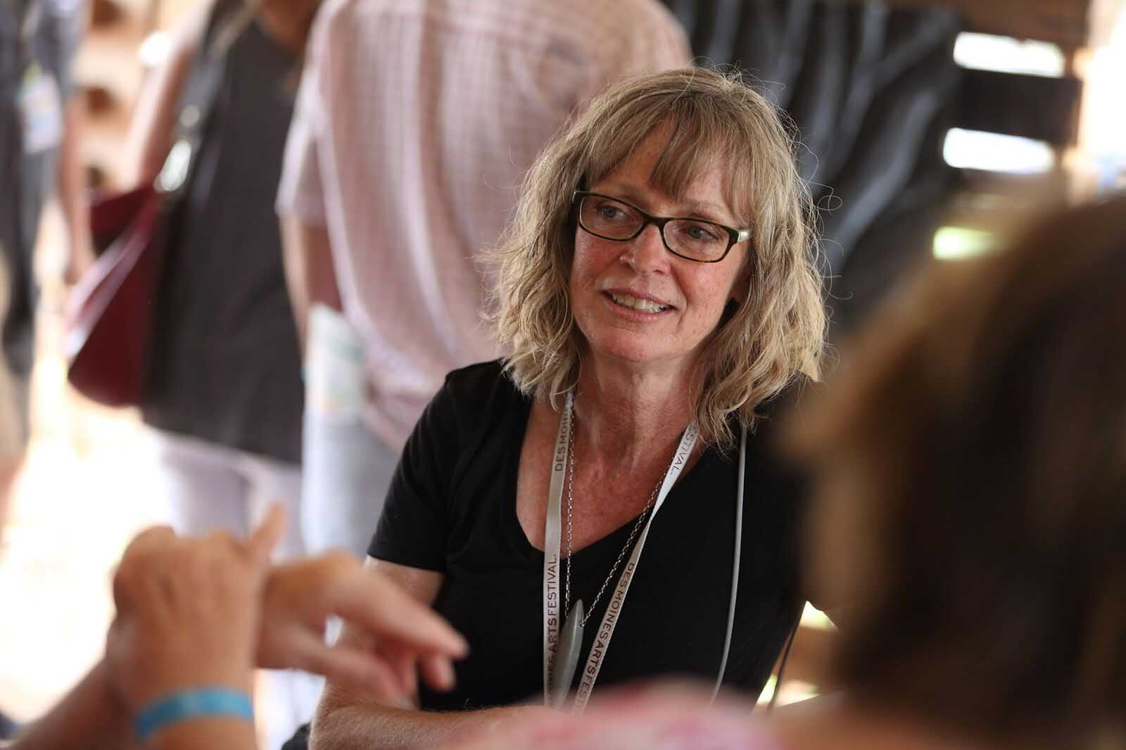 Leslie Ann Guinean, Hidden Springs artist, DMAF Curated exhibit and presentations in the Creative Cafe area of the Silent Rivers VIP Club at the 2018 Des Moines Arts Festival