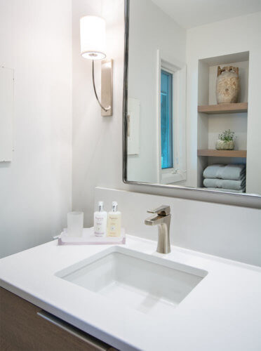 modern style white and wood Des Moines bathroom remodel by Silent Rivers